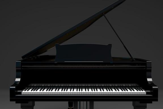 black gard piano on a dark background