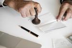 People checking bankbook isolated on white table. People checking bankbook isolated on white table