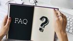 Fragen und Antworten Ein Notizbuch mit der Aufschrift "FAQ" und einem "Fragezeichen"