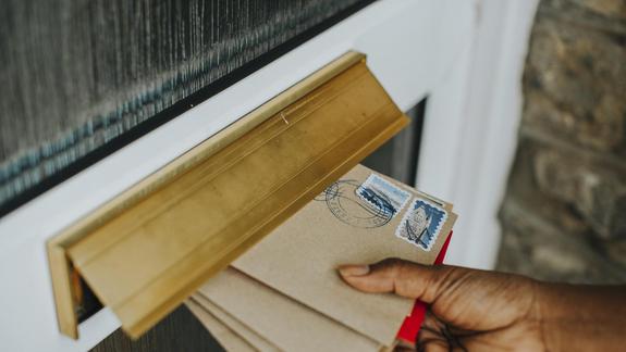Woman picking up the mail