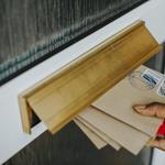 Woman picking up the mail