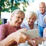 Seniors taking selfie with smartphone